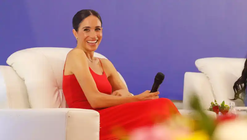 Meghan Markle explains why she wore a red dress in Nigeria.